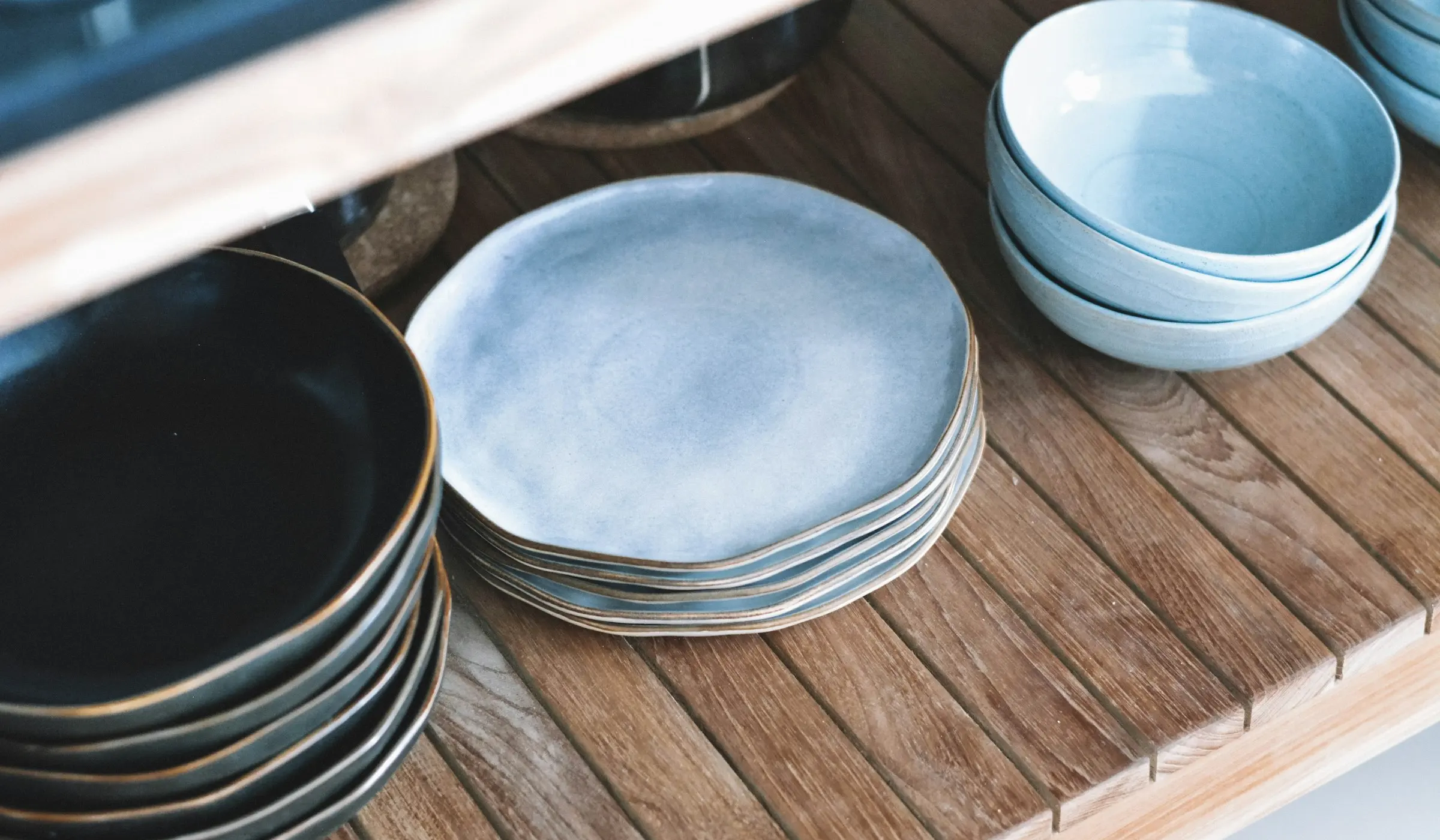 Handmade ceramic bowls on a linen cloth